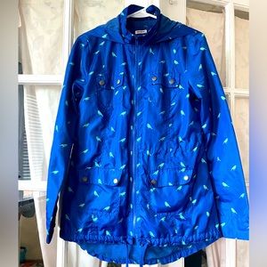 Water resistant blue bird print jacket with inner cotton lining.